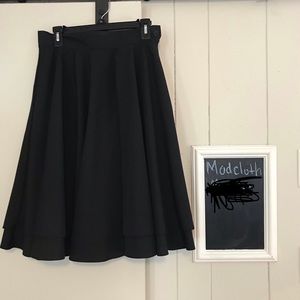 High-waisted black skirt